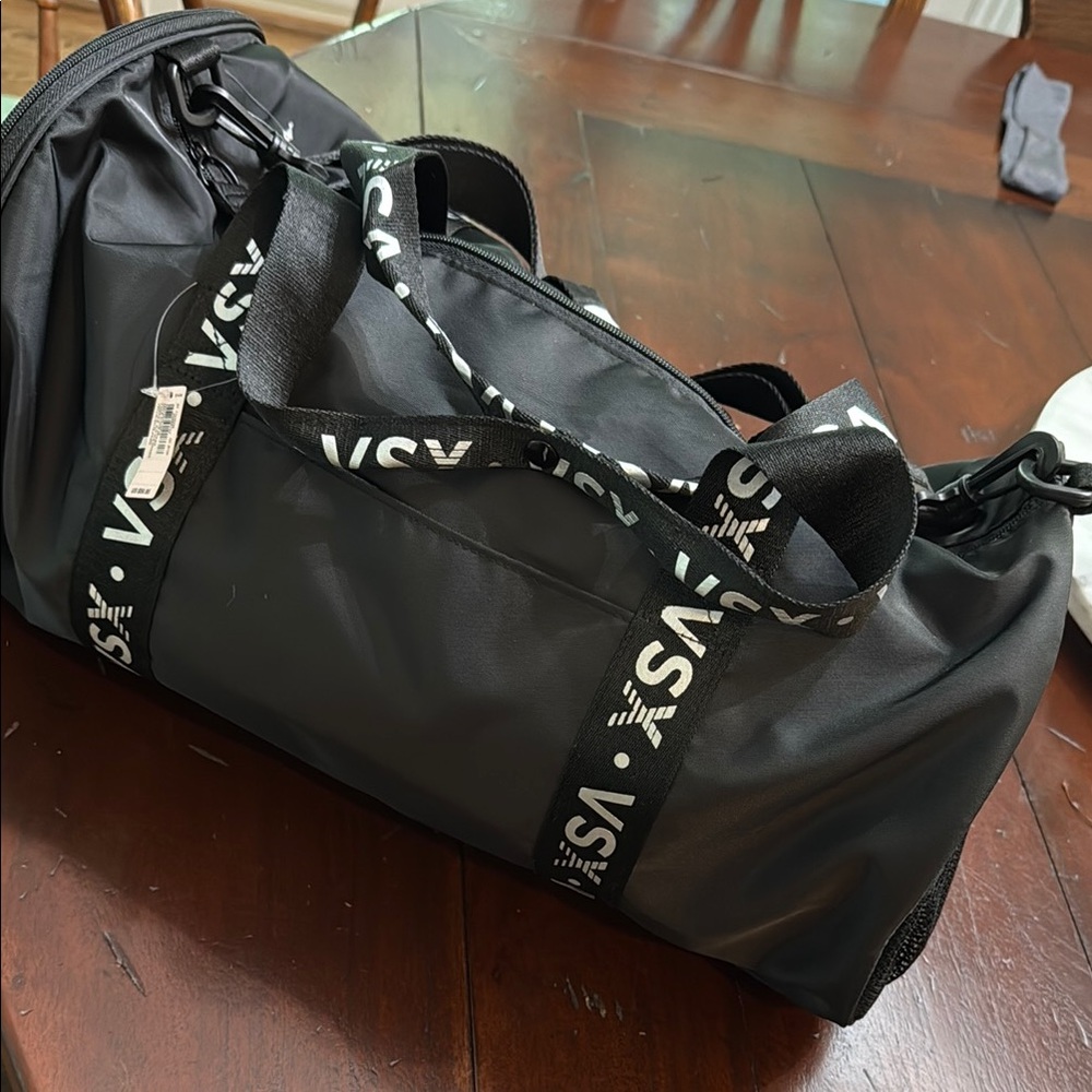 New with tag. Victoria's Secret Black Duffel Bag with Logo Straps